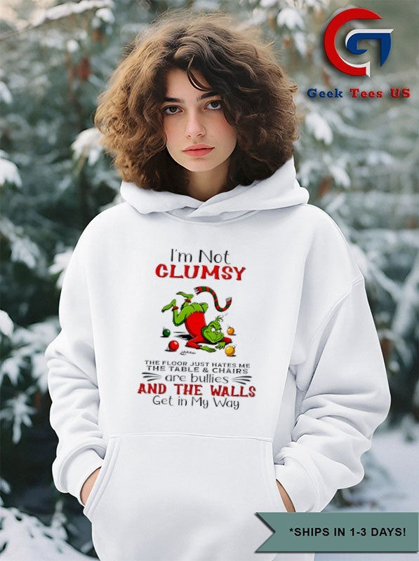 Grinch I’m not clumsy the floor just hates me the table and chairs are bullies Christmas shirt
