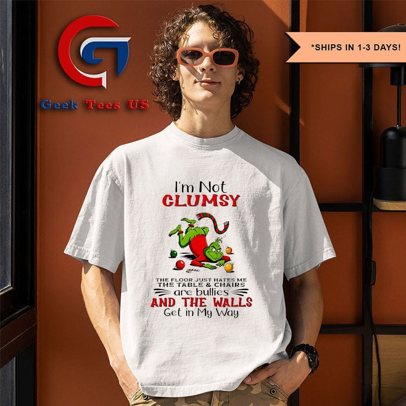 Grinch I’m not clumsy the floor just hates me the table and chairs are bullies Christmas shirt