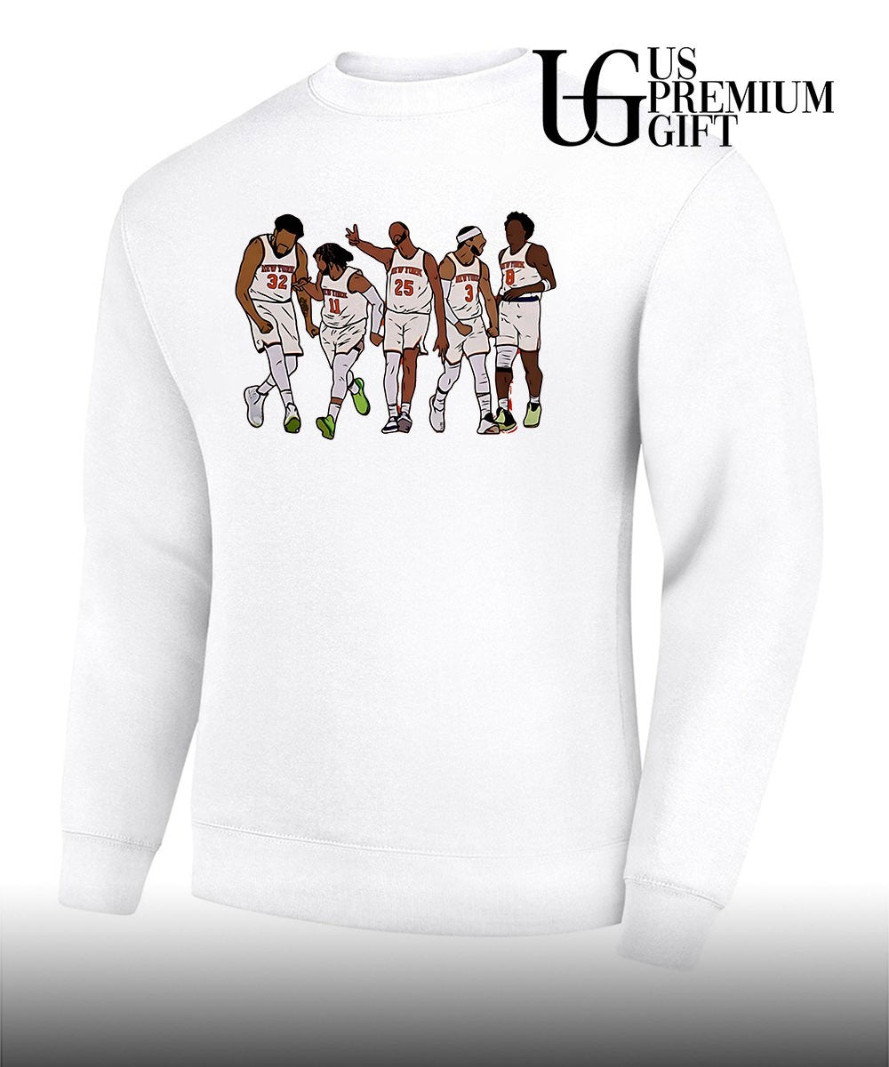 Jon Stewart wearing New Yokr Knicks Starting Five shirt