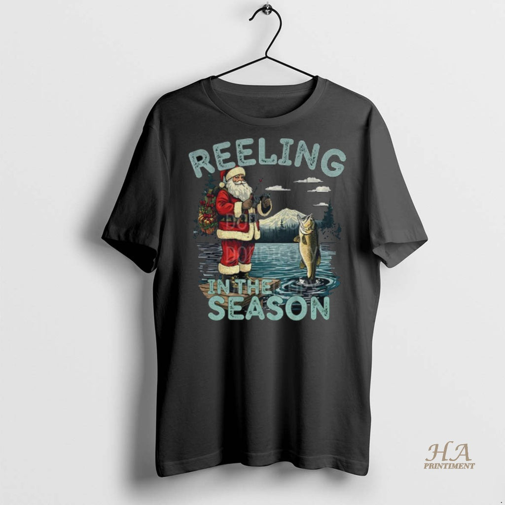Official Fishing Santa Claus Reeling In The Season Merry Christmas Shirt