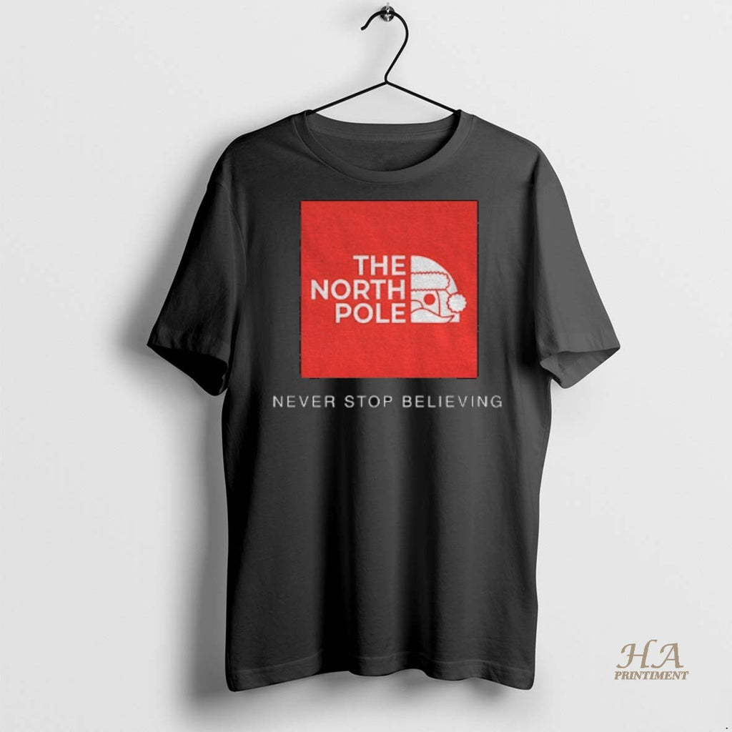 Official North Pole Never Stop Believing Christmas Shirt