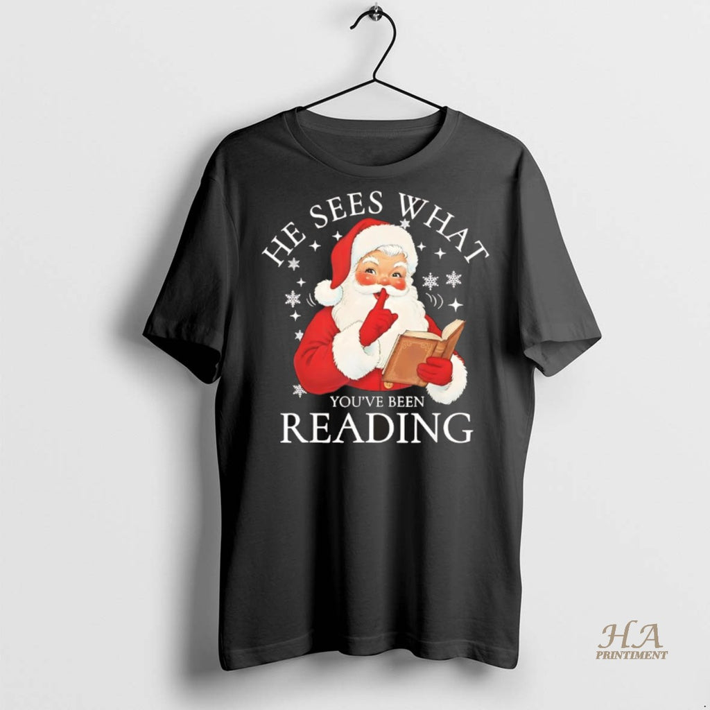 Official Santa He Sees What Youve Been Reading Christmas Chriast Shirt