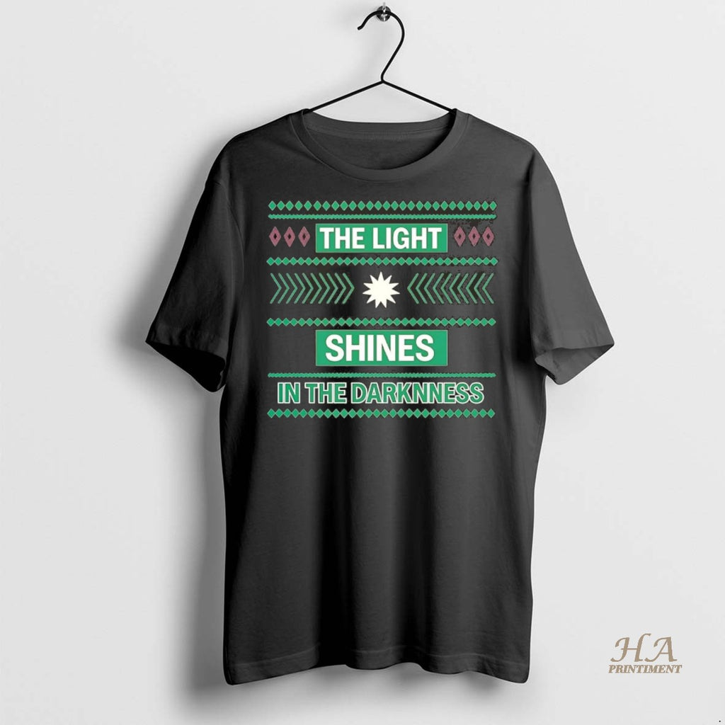 Official The Light Shines In The Darkness Ugly Christmas Chriast Shirt
