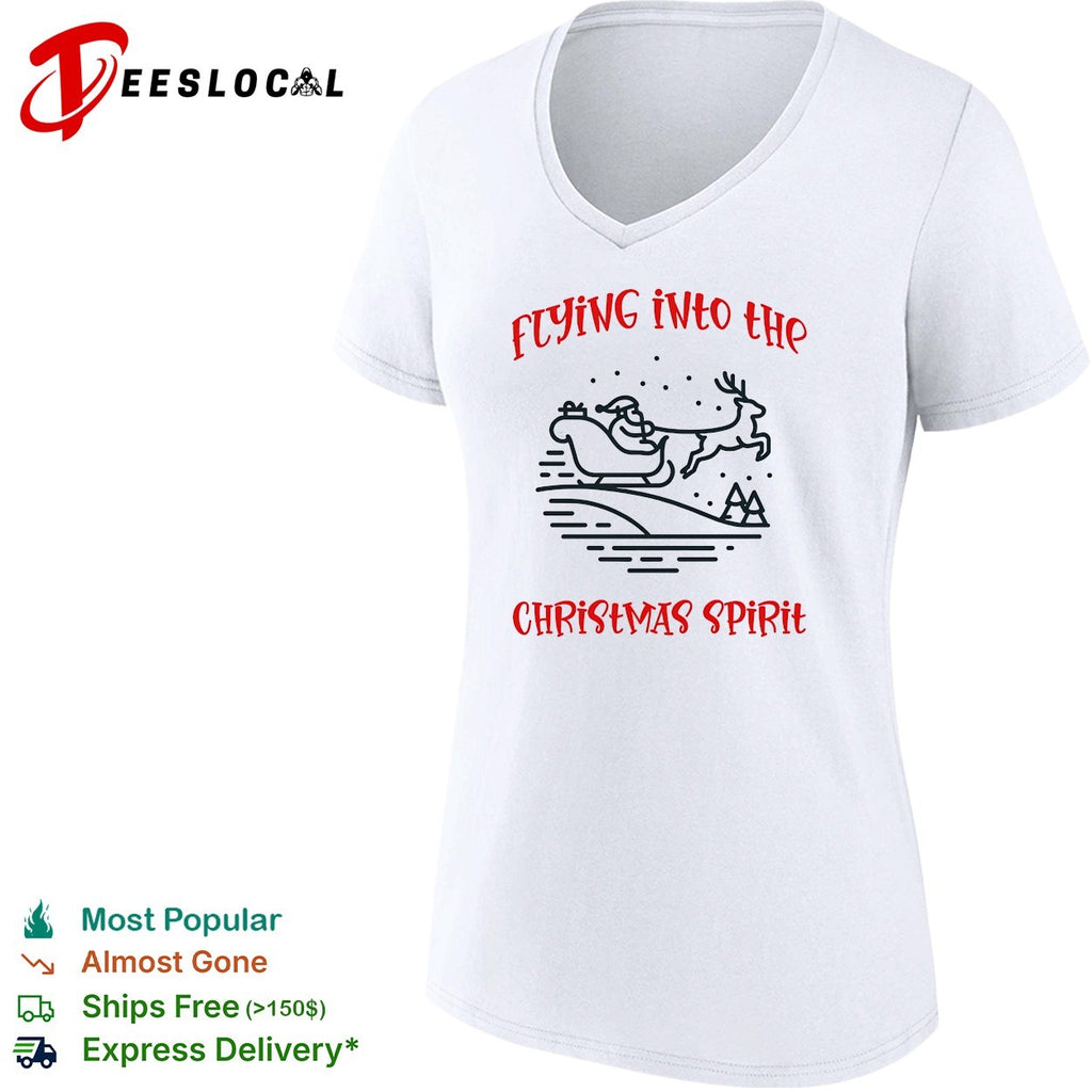 Santa Claus flying sleigh pulled by reindeer through falling snow christmas spirit shirt