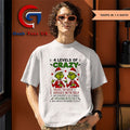 Santa hat Grinch 4 levels of crazy talks to self argues with self interrupts self while Merry Christmas shirt