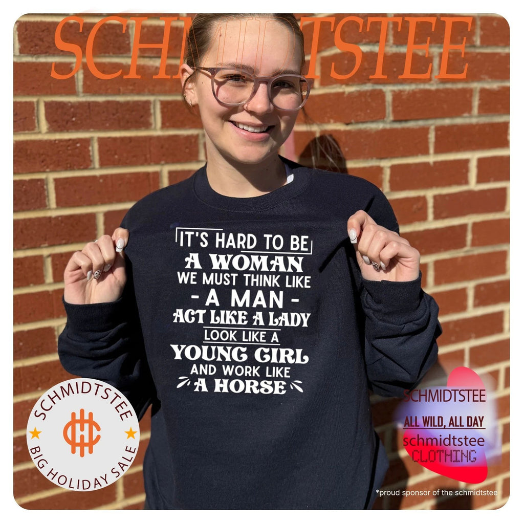 It’s hard to be a woman we must think like a man act like a lady look like a young girl and work like a horse shirt